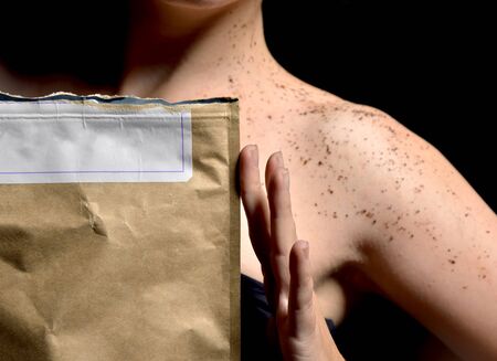 Closeup portrait of beautiful girl body shoulder with body cream powder and rustic bag with text...