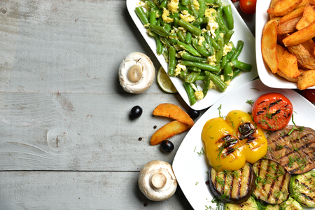 Grilled BBQ Vegetables french fries potatoes paprika and sauce on rustic wood composition  backgroundの写真素材