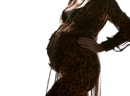 Pregnancy motherhood expectation concept close up image of pregnant woman big bellyの写真素材