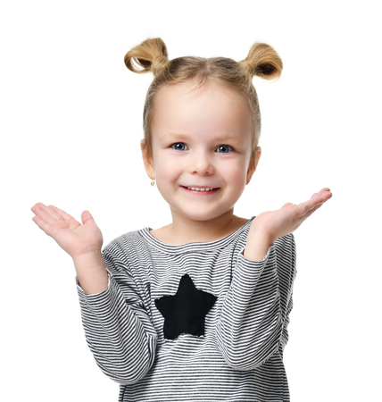 Young happy girl show something with hands for text copy space isolated on a white backgroundの写真素材