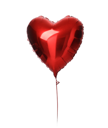 Single big  red heart balloon object for birthday party isolated on a white backgroundの写真素材