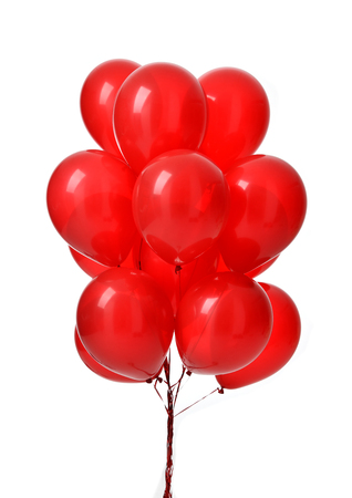 Bunch of big red balloons object for birthday party isolated on a white backgroundの写真素材