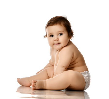 Infant baby girl toddler fat over weight sitting happy smiling isolated on white backgroundの写真素材
