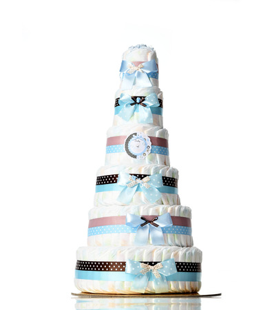 Diapers cake six leveled diaper cake with blue ribbons and bows for baby boy infant isolated on a white backgroundの写真素材