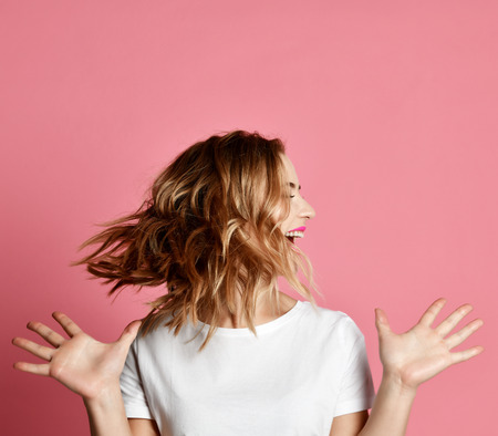 Emotional woman shake a head screaming shouting yelling closeup portrait on pink background. Female...