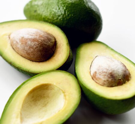 Fresh avocado slices on white background closeupの写真素材