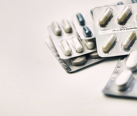 pills in blister pack on the white tableの写真素材