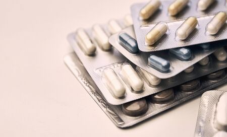 close-up pills in blister pack on the white table