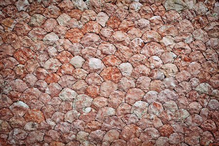 Natural motted pink stone wall backgroundの写真素材