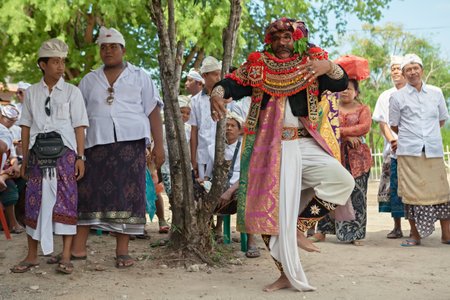 BALI, INDONESIA - MAY 31: Artist of the traditional Balinese street theater Topeng participates in the performance after hindu ceremony near the Sakenan temple in Bali island on 31 May, 2014のeditorial素材