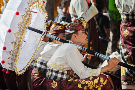Denpasar, Bali island, Indonesia - June 11, 2016: Beautiful young man in traditional Balinese people...