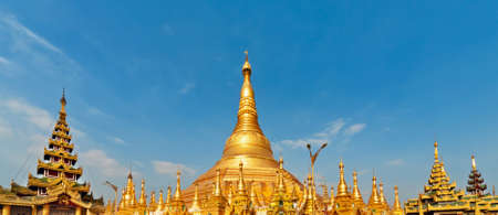 View of famous Myanmar temple and popular place to visit at Yangon city tour - pagoda Shwedagon with Buddha relics. Famous travel destination in Asia. Traditional Burmese art and culture background.の写真素材