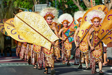 DENPASAR, BALI ISLAND, INDONESIA - JUNE 11, 2016: Group of Balinese people. Beautiful dancer women...