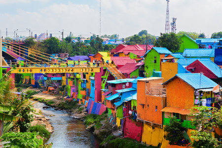 Malang, Indonesia - July 12, 2018: Jodipan village with painted colorful houses ( Kampung Warna Warni ) Popular place to visit for city walking tour on family holidays. Travel destination in East Javaのeditorial素材
