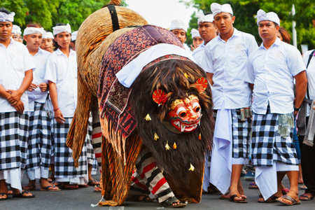 Bali, Indonesia - June 23, 2018: Dancer men in ethnic costumes walk with traditional mask of...
