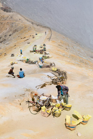 Java island, Indonesia - September 16, 2019: Baskets with natural sulfur carried from crater mine in miners rest camp. Extensive manual labour at sulphur mining operation in Kawah Ijen volcanoのeditorial素材