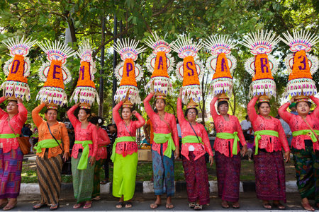 DENPASAR, BALI ISLAND, INDONESIA - JUNE 10, 2017: Group of beautiful women in traditional Balinese...