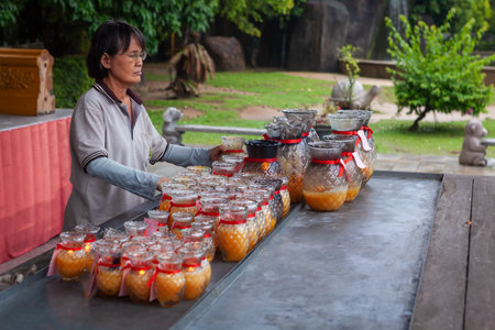 Georgetown, Penang, Malaysia - September 04, 2014: Lighting lamps for peace in Kek Lok Si temple, Penang. Chinese word peacefully for family written on the ribbonのeditorial素材