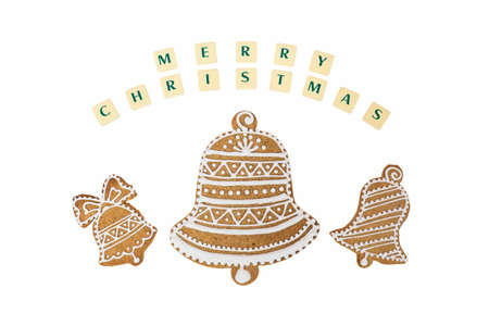 Homemade three bells gingerbread and honey cookies on nice christmas theme with a wishes on white background.の写真素材