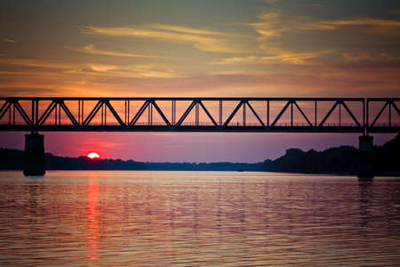 Sunset on the river with bridge.の写真素材