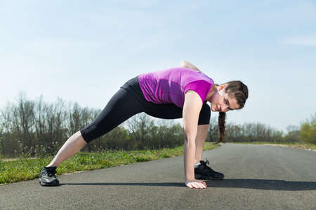 Young beautiful woman stretching before sport workout for healthy lifestyle .の写真素材