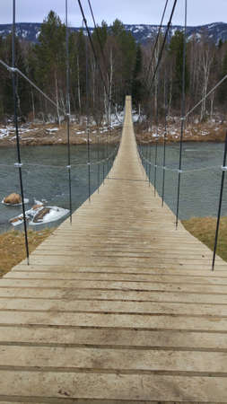 Late autumn. It's already cold and snowing. The mountain river begins to freeze and is covered with...