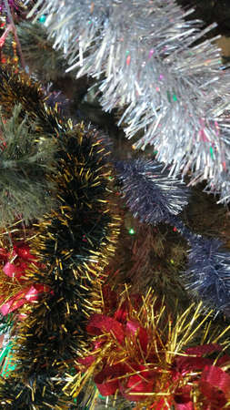 Christmas tree in lights, garlands, streamers with tinsel and a great mood.
