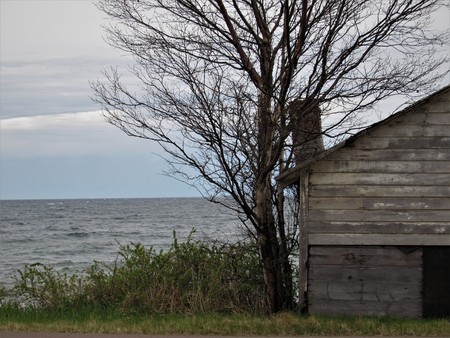 Abandoned house by a lakeの写真素材