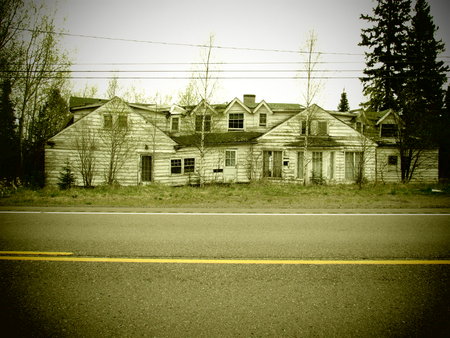 Abandoned building on the side of the roadの写真素材