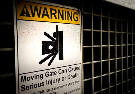 Warning sign on a fenceの写真素材