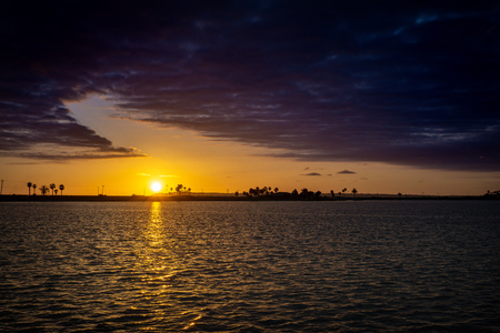 Sunset by the oceanの写真素材