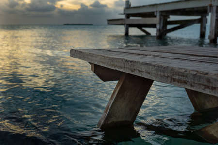 Bench sitting in the oceanの写真素材