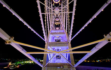 The underside of a colored ferris wheelの写真素材