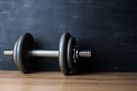 metal barbell on dark gray backgroundの写真素材