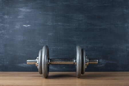 metal barbell on dark gray backgroundの写真素材