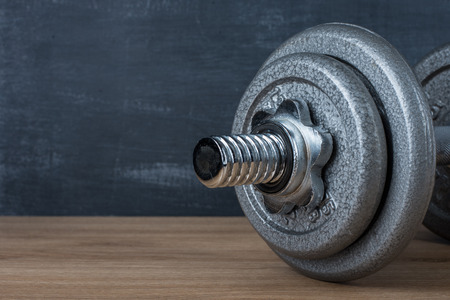 metal barbell on dark gray backgroundの写真素材