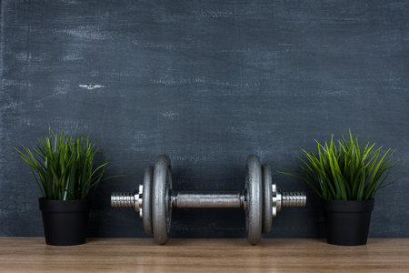 metal barbell on dark gray backgroundの写真素材