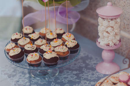 Details of a tasty candy bar with jugs of sweets, cookies and marshmallowsの写真素材