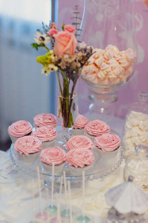 Details of a tasty candy bar with jugs of sweets, cookies and marshmallowsの写真素材
