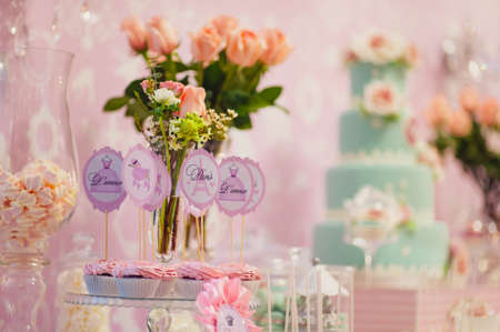 Details of a tasty candy bar with jugs of sweets, cookies and marshmallowsの写真素材
