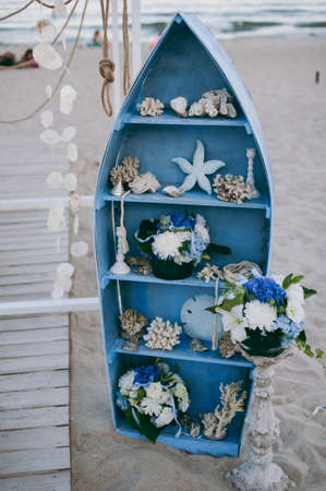 Original wedding floral decoration in the form of mini-vases and bouquets of flowers hanging from the ceilingの写真素材