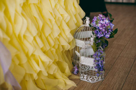 Original wedding floral decoration in the form of mini-vases and bouquets of flowers hanging from the ceilingの写真素材