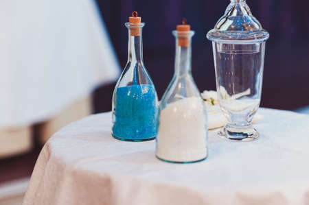 Original wedding floral decoration in the form of mini-vases and bouquets of flowers hanging from the ceilingの写真素材