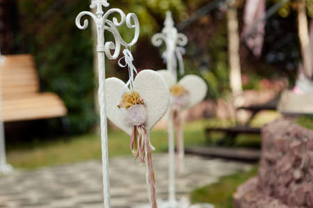 Original wedding floral decoration in the form of mini-vases and bouquets of flowers hanging from the ceilingの写真素材