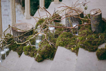 Original wedding floral decoration in the form of mini-vases and bouquets of flowers hanging from the ceilingの写真素材