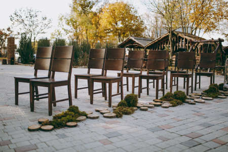 Decoration of chairs at the wedding. Beautiful chairs with decorationsの写真素材