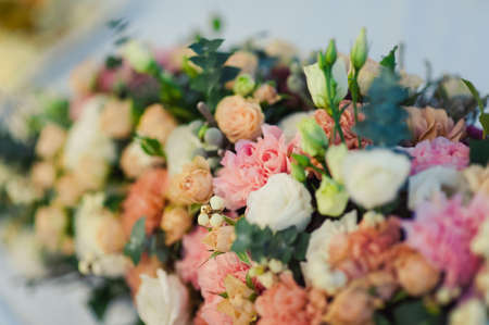 Original wedding floral decoration in the form of mini-vases and bouquets of flowers hanging from the ceilingの写真素材