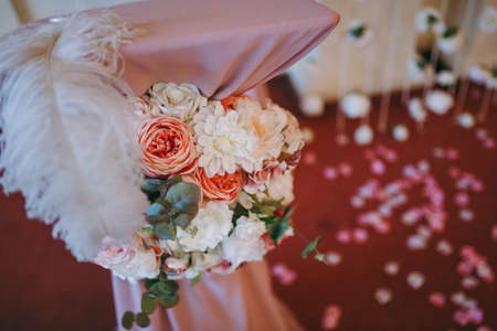 Original wedding floral decoration in the form of mini-vases and bouquets of flowers hanging from the ceilingの写真素材