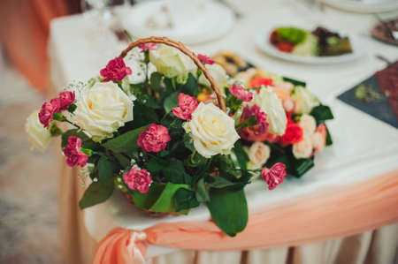 Original wedding floral decoration in the form of mini-vases and bouquets of flowers hanging from the ceilingの写真素材