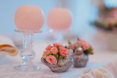 Original wedding floral decoration in the form of mini-vases and bouquets of flowers hanging from the ceilingの写真素材